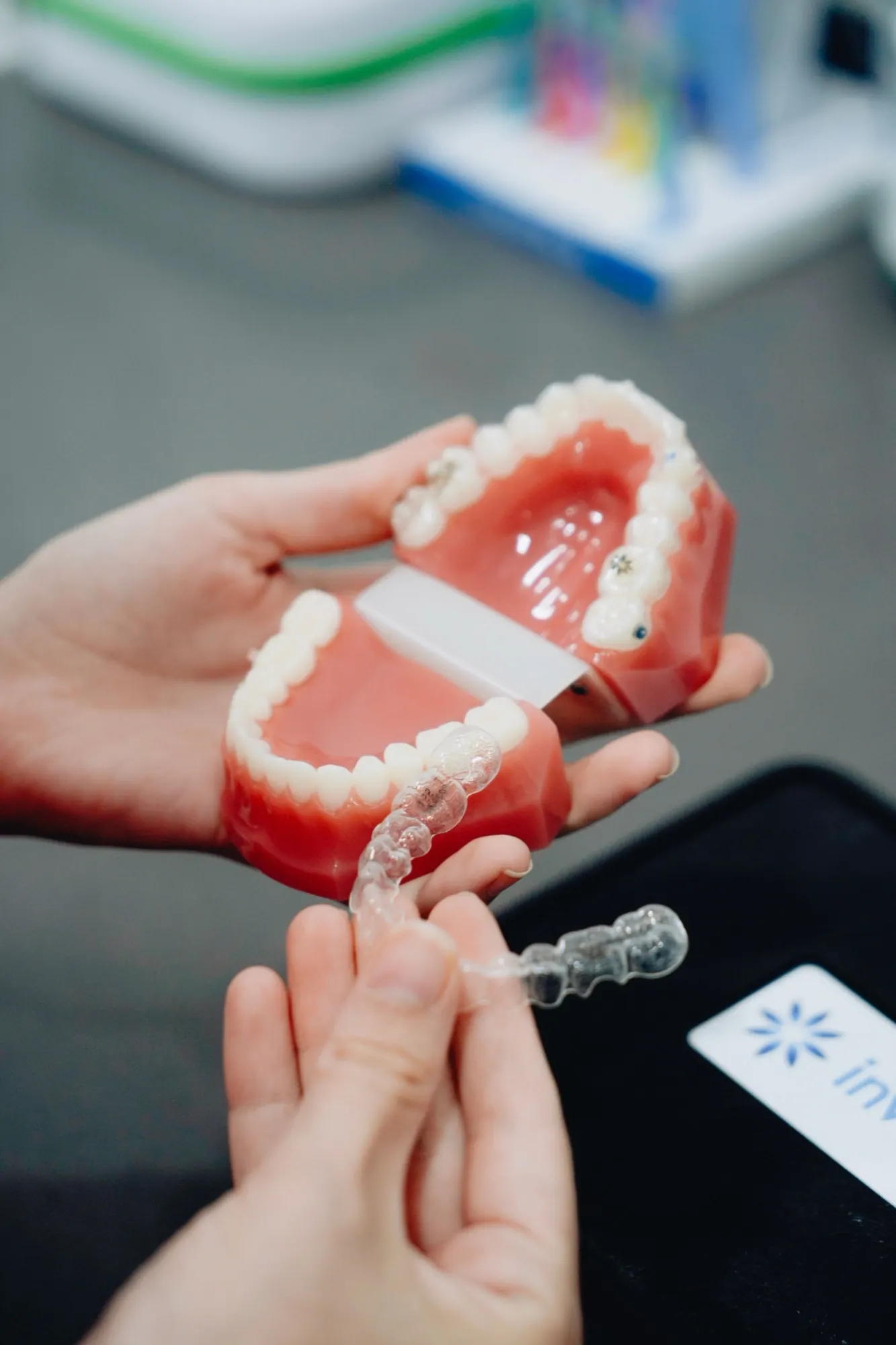 A dental model with a clear aligner and its case