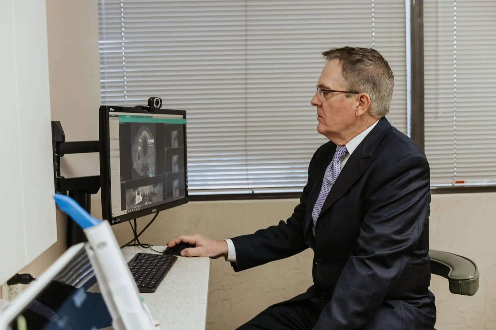 Dr. Steven W. Haywood, DDS reviewing a 3D cone beam scan
