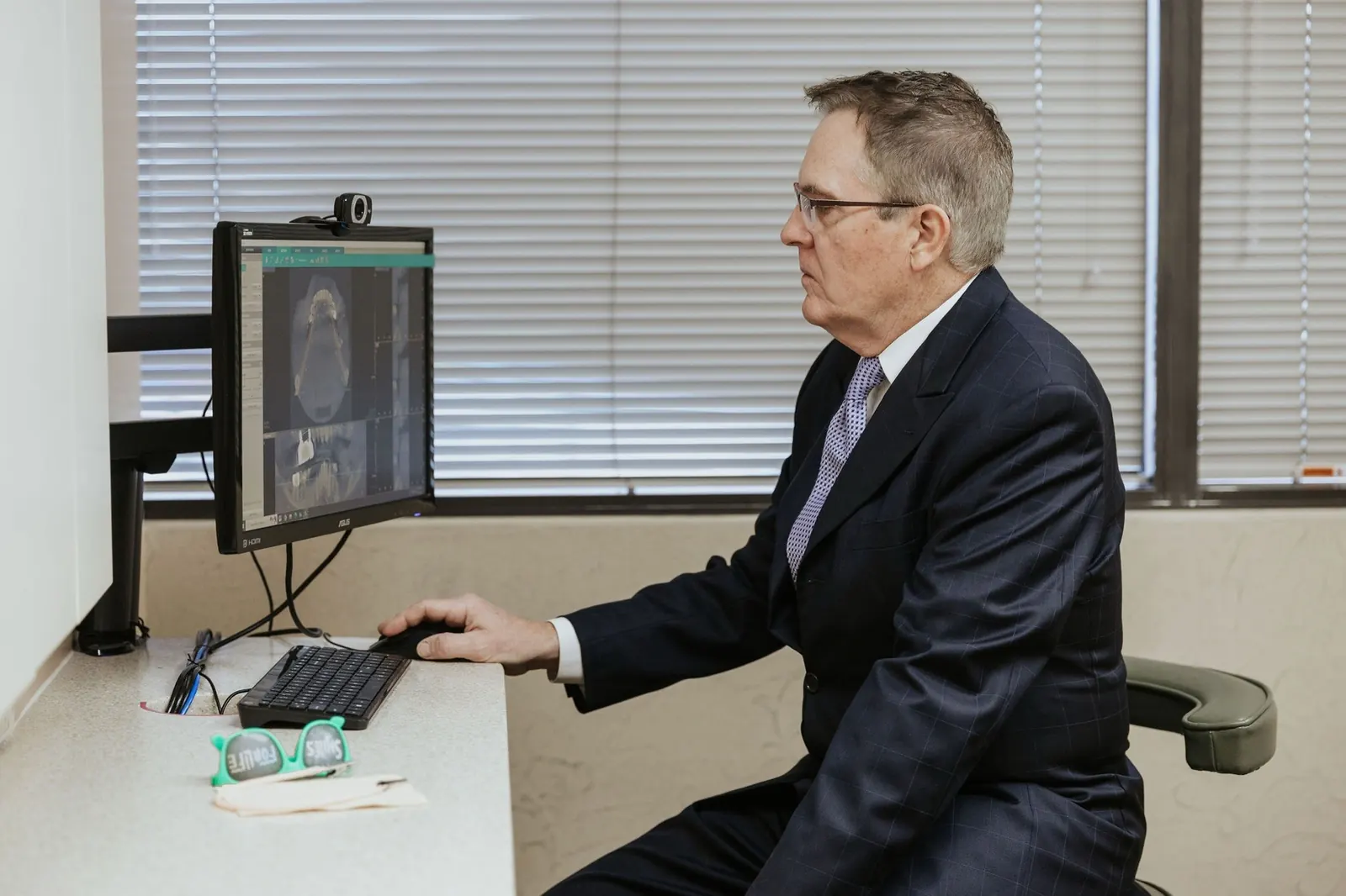 Dr. Steven W. Haywood, DDS reviewing a 3D scan of the jaw