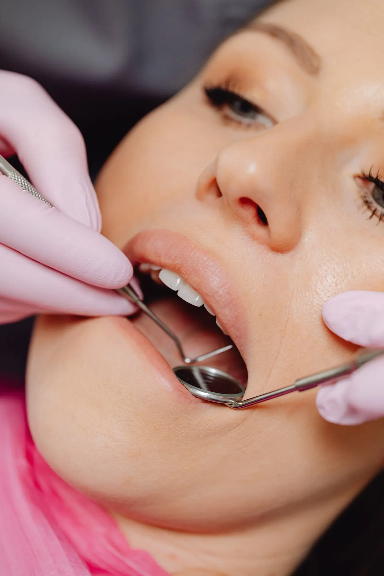 A dental mirror exam of the teeth and gums