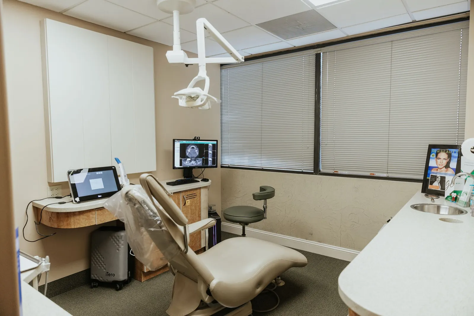A treatment room with patient-education monitors