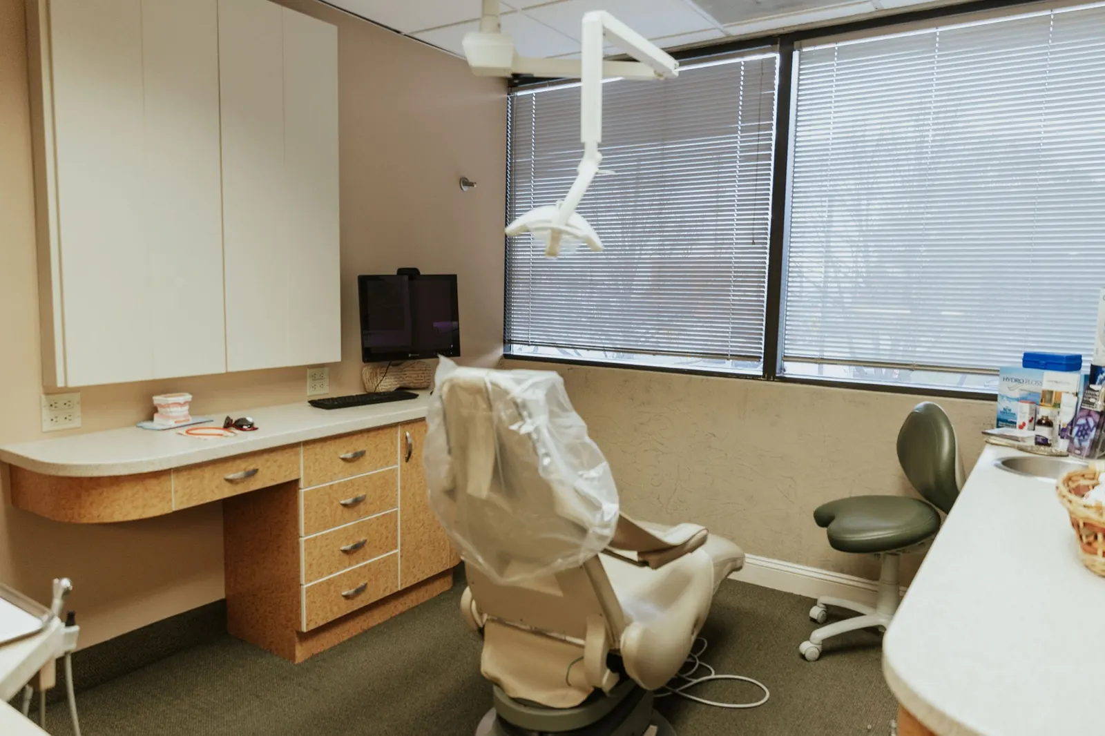 A treatment room with a chairside monitor