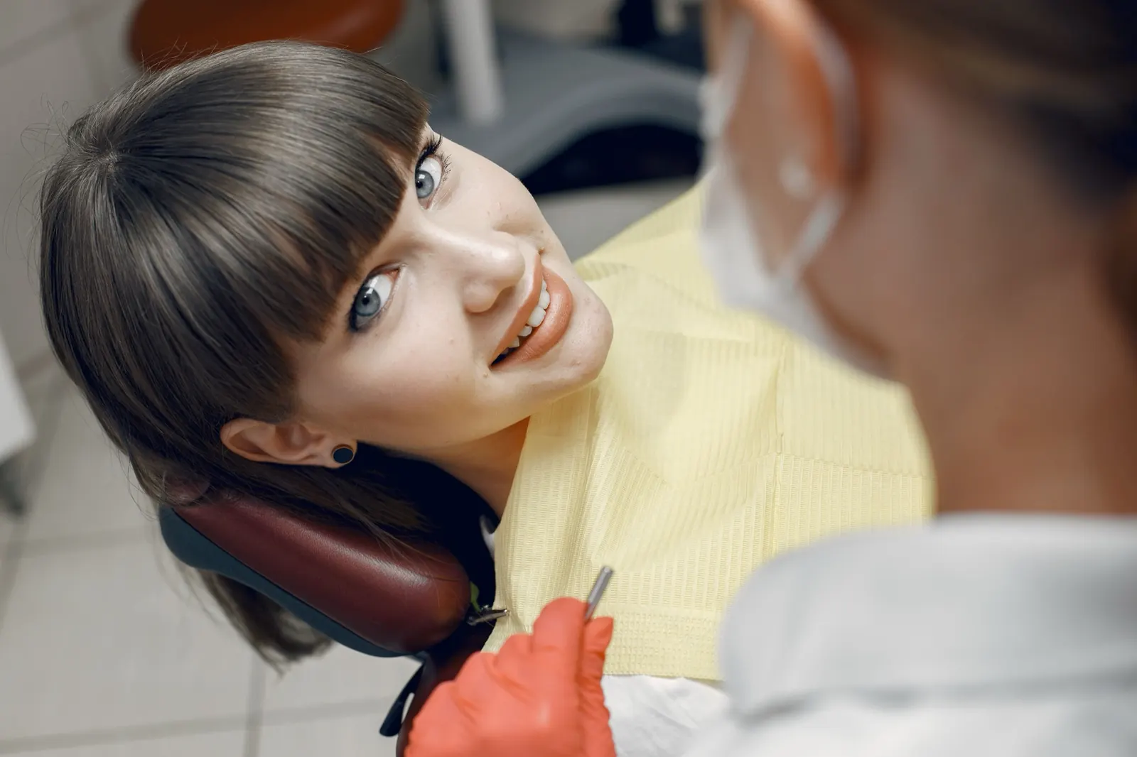A patient smiling in a dental chair