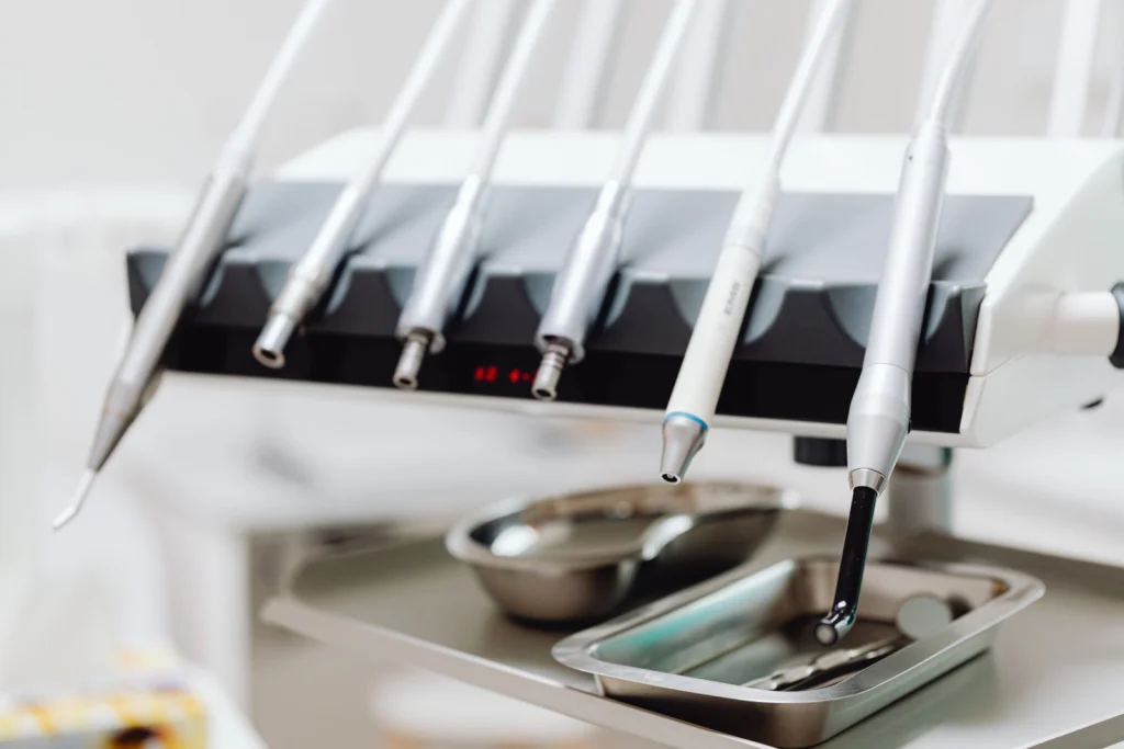 High-tech dental tools and instruments in a dental clinic setting, showcasing advanced healthcare technology.