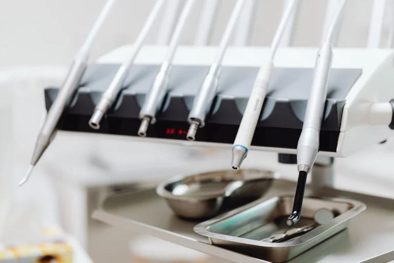 High-tech dental tools and instruments in a dental clinic setting, showcasing advanced healthcare technology.