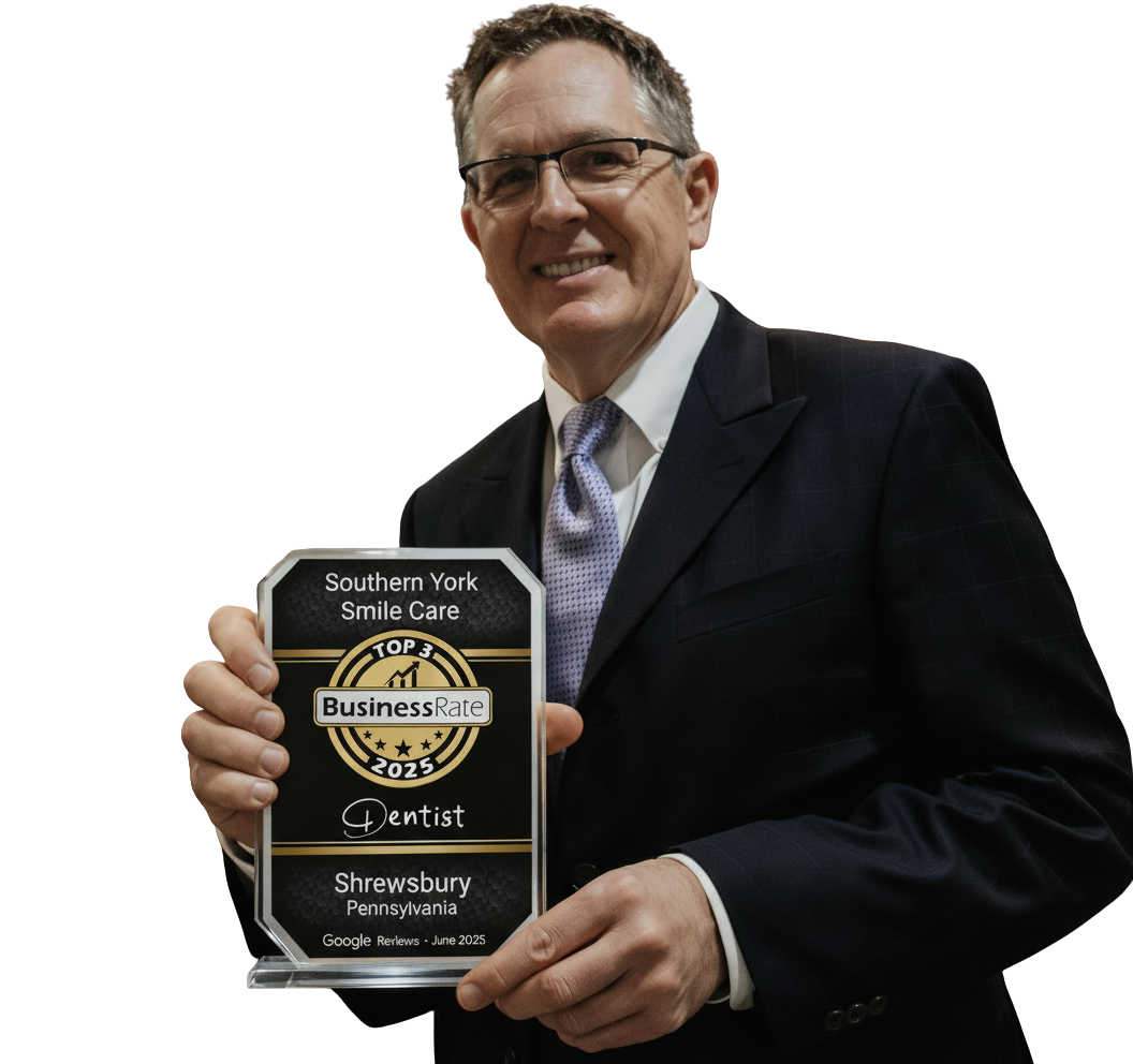 Dr. Haywood with Top 3 Dentist 2025 award